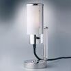 "Nachttischlampe, auch als Wandleuchte verwendbar" war die ursprüngliche Bezeichnung dieser Leuchte im Prospekt der Weimar Bau- und Wohnungskunst GmbH.Wilhelm Wagenfeld entwarf 1930